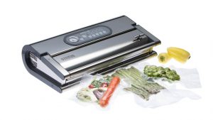 Profesionalni vakuumski aparat Status Provac 360 z zavakuumiranimi šparglji, korenčkom in brstičnim ohrovtom.